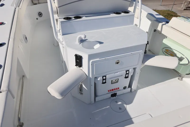 Slide: The Image of 2026 Sea Hunt Ultra 275 SE boat interior with seating and storage features. - 22