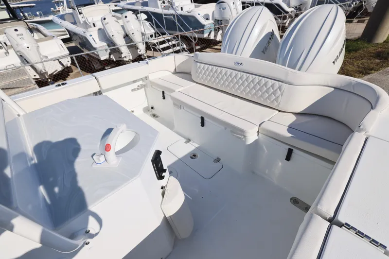 Slide: The Image of 2026 Sea Hunt Ultra 275 SE boat interior with white seating and dual Yamaha engines. - 28