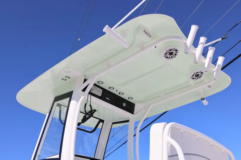 Slide: The Image of 2026 Sea Hunt Ultra 275 SE boat top view with rod holders and speakers. - 29