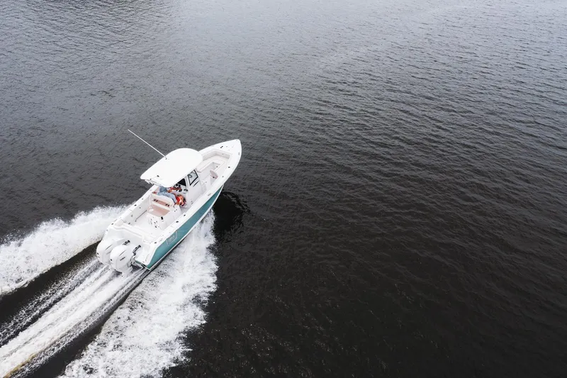 Slide: The Image of Aerial view of 2026 Sea Hunt Ultra 275 SE boat cruising on open water. - 35