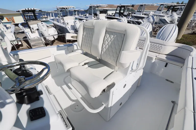 Slide: The Image of 2026 Sea Hunt Ultra 275 SE boat interior with luxurious seating and steering wheel. - 4