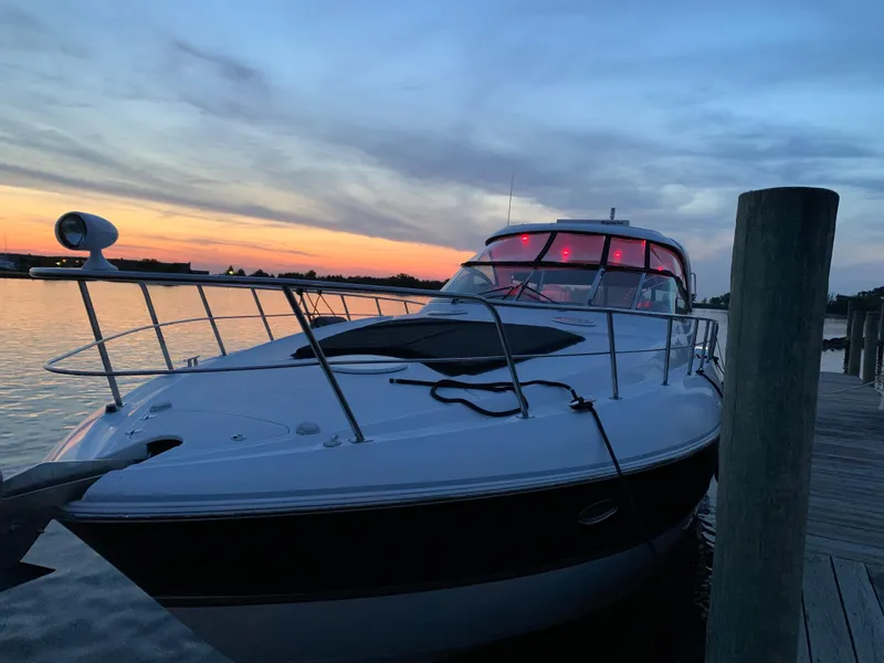 Slide: The Image of 2005 Cruisers Yachts 520 Express docked at sunset. - 3