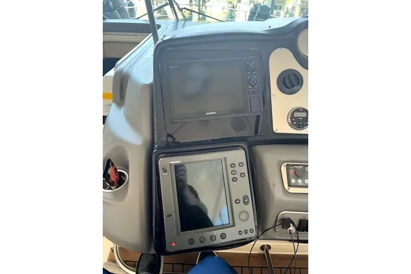 Slide: The Image of 2005 Cruisers Yachts 520 Express dashboard with navigation equipment and controls. - 39