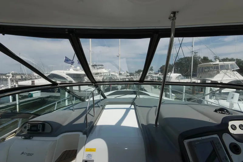 Slide: The Image of Interior view of 2005 Cruisers Yachts 520 Express in marina. - 16