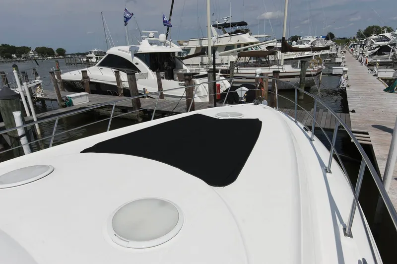 Slide: The Image of 2005 Cruisers Yachts 520 Express docked at marina. - 18