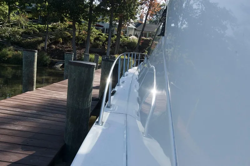 Slide: The Image of 2005 Cruisers Yachts 520 Express at dock, side view. - 20