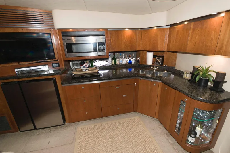 Slide: The Image of Luxurious kitchen on a 2005 Cruisers Yachts 520 Express. - 24
