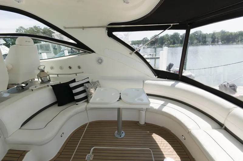 Slide: The Image of Interior of a 2005 Cruisers Yachts 520 Express with elegant seating area. - 7