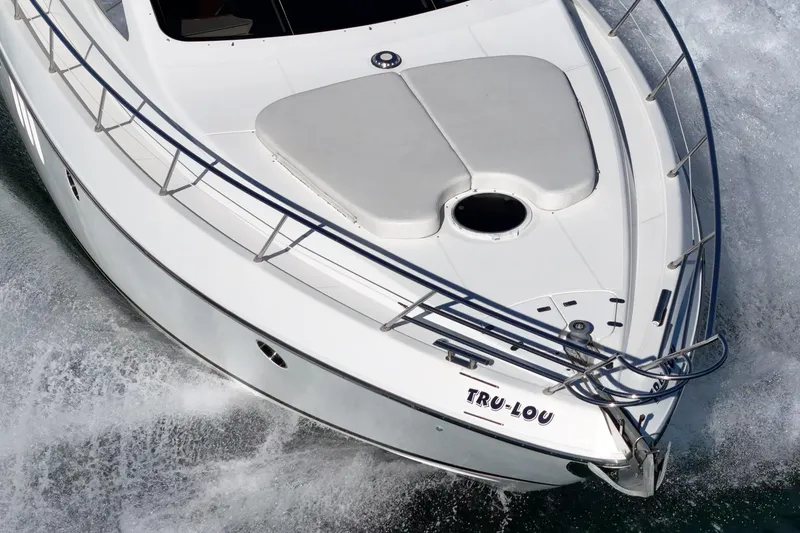 Slide: The Image of 2002 Azimut 58 yacht cruising on water, aerial view of bow. - 11