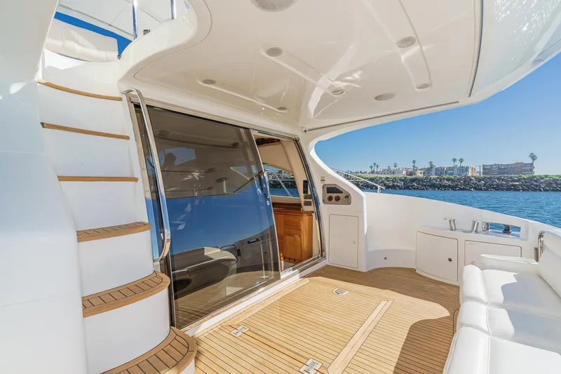 Slide: The Image of Luxurious 2002 Azimut 58 yacht deck with teak flooring and ocean view. - 25