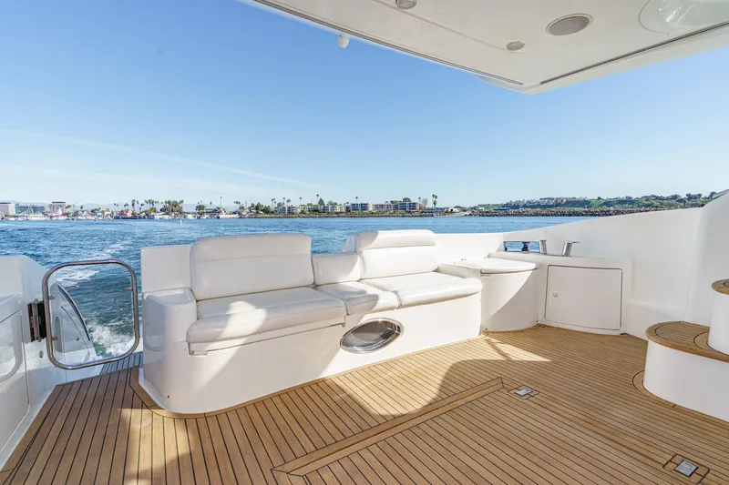 Slide: The Image of Luxurious 2002 Azimut 58 yacht deck with white seating and ocean view. - 26