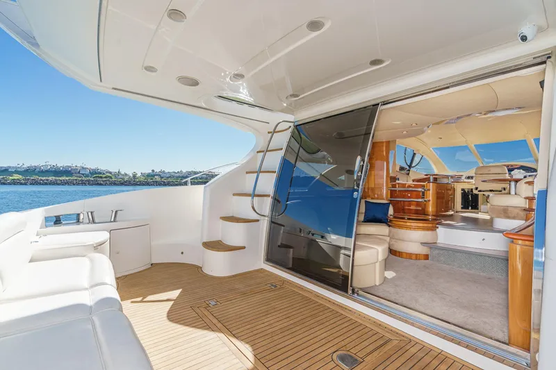 Slide: The Image of Luxurious 2002 Azimut 58 yacht interior with elegant seating and scenic ocean view. - 27