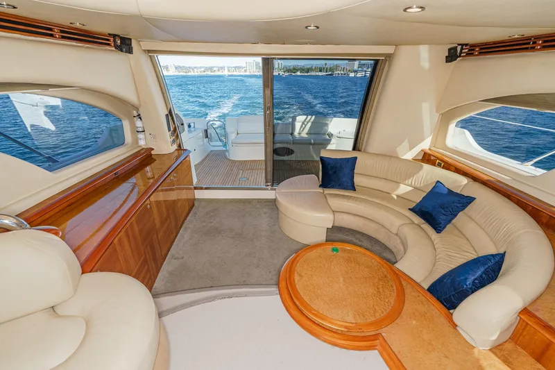 Slide: The Image of Luxurious interior of 2002 Azimut 58 yacht with elegant seating and ocean view. - 28