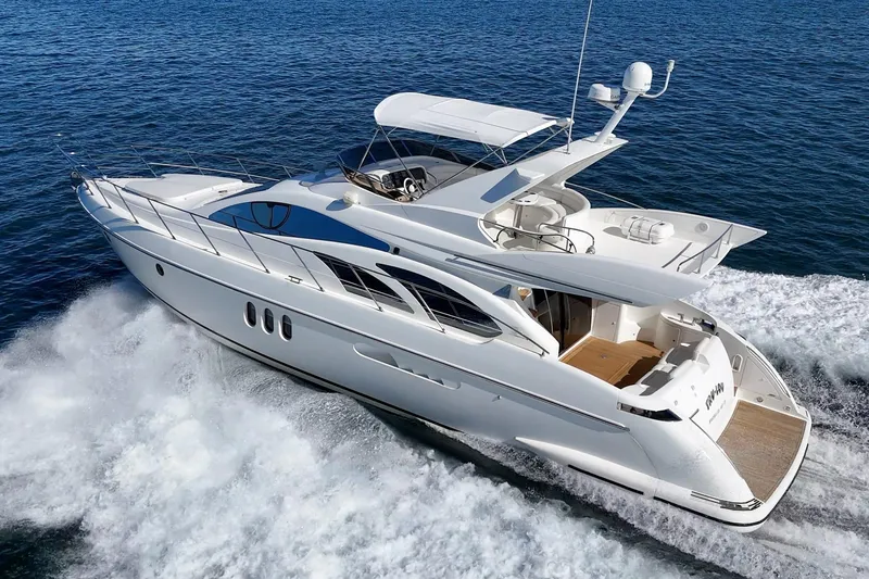 Slide: The Image of Luxury 2002 Azimut 58 yacht cruising on open water, showcasing sleek design and elegance. - 3