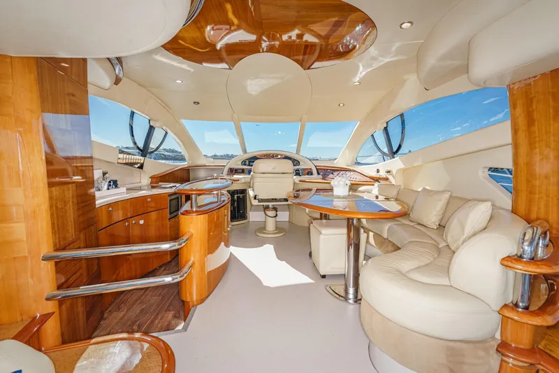 Slide: The Image of Luxurious interior of a 2002 Azimut 58 yacht with elegant wood and leather finishes. - 32