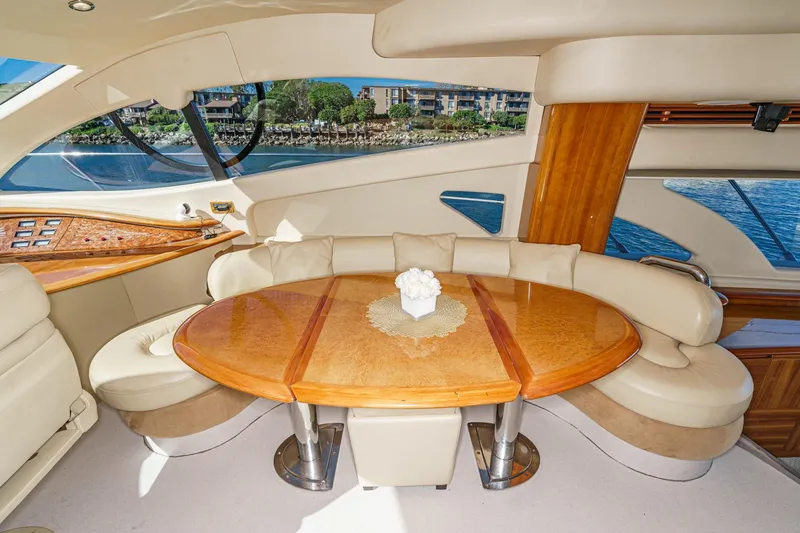 Slide: The Image of Luxurious interior of 2002 Azimut 58 yacht with elegant seating and wooden table. - 33