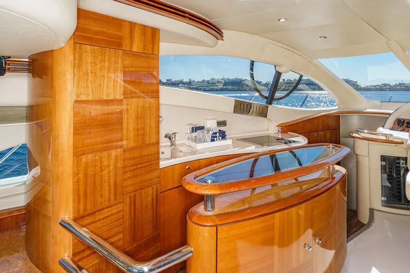 Slide: The Image of Luxurious interior of 2002 Azimut 58 yacht with polished wood and ocean view. - 34