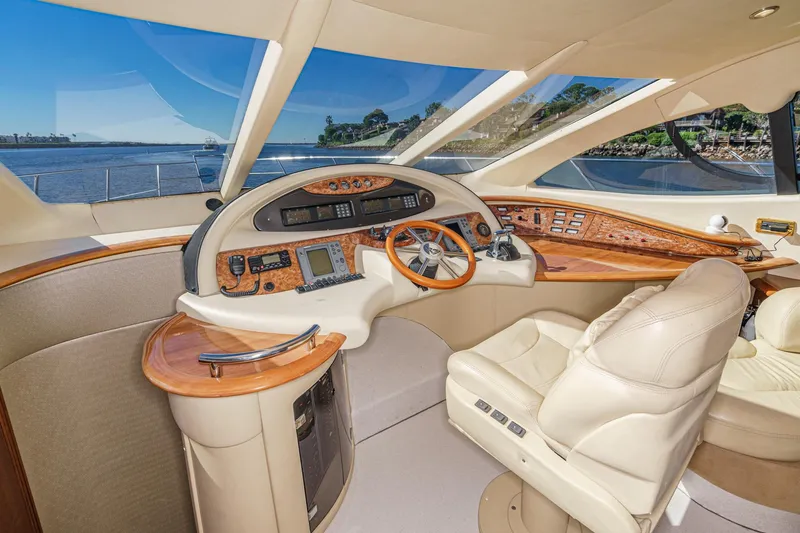 Slide: The Image of Luxurious 2002 Azimut 58 yacht cockpit with leather seating and advanced navigation controls. - 36