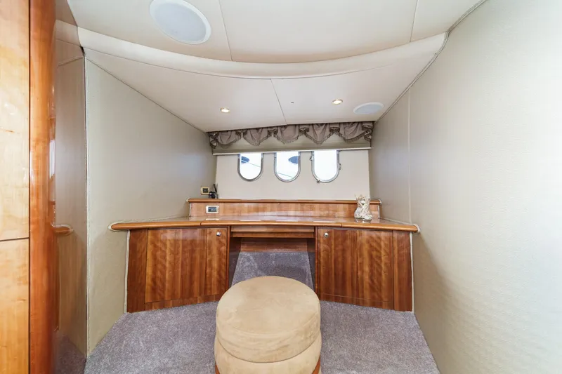 Slide: The Image of Luxurious interior of 2002 Azimut 58 yacht with elegant wood finish and plush seating. - 42