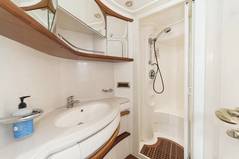 Slide: The Image of Luxurious bathroom in a 2002 Azimut 58 yacht, featuring modern fixtures and elegant design. - 44
