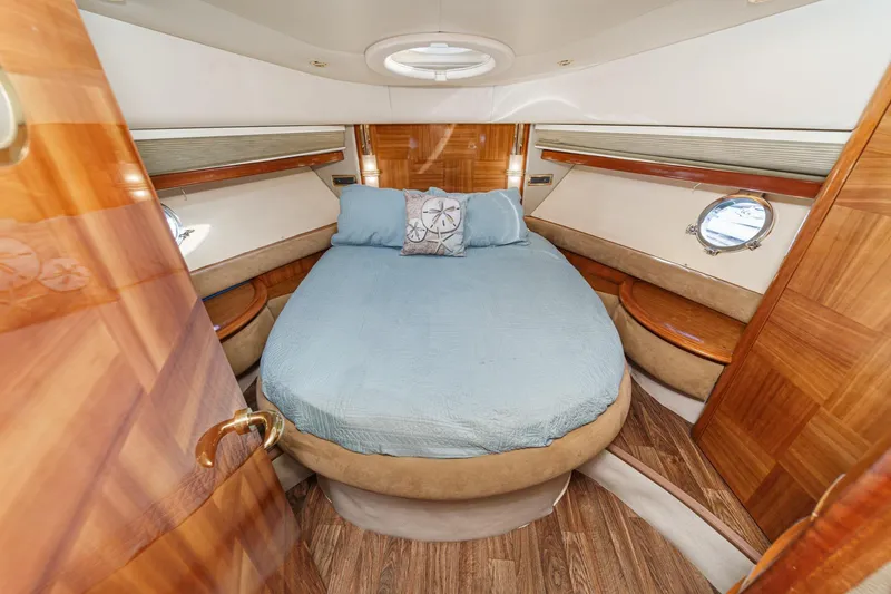 Slide: The Image of Luxurious cabin interior of a 2002 Azimut 58 yacht with elegant wood finishes. - 45