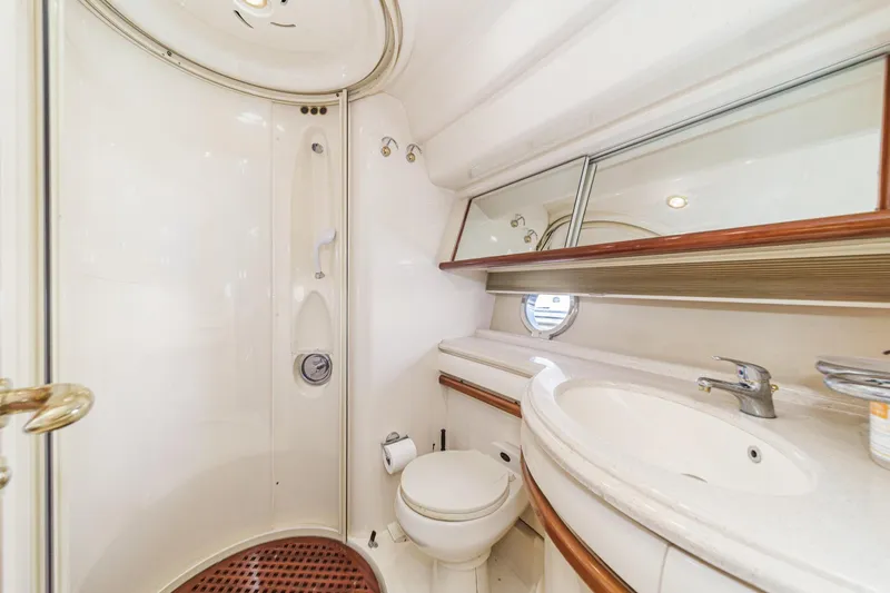 Slide: The Image of Luxurious bathroom in 2002 Azimut 58 yacht with shower, sink, and mirror. - 47