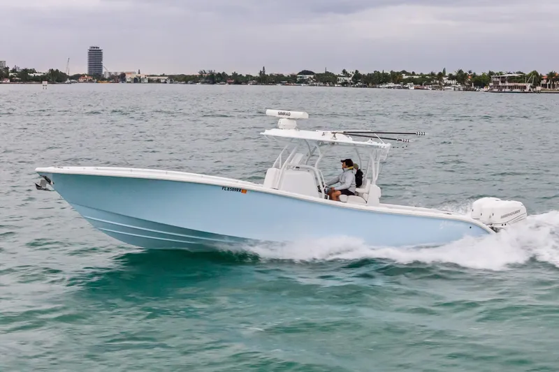 Slide: The Image of 2021 Yellowfin 36 Offshore boat cruising on open water. - 12