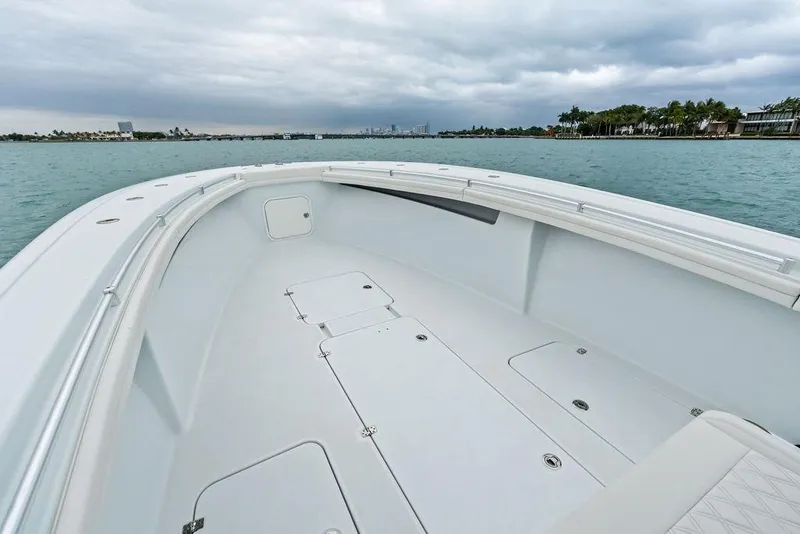 Slide: The Image of 2021 Yellowfin 36 Offshore boat deck with ocean view and cloudy sky. - 19