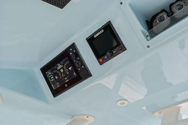 Slide: The Image of 2021 Yellowfin 36 Offshore boat dashboard with Simrad navigation system. - 26