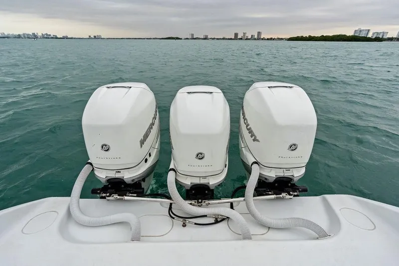 Slide: The Image of Triple Mercury outboard engines on 2021 Yellowfin 36 Offshore boat in open water. - 30