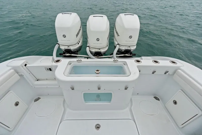 Slide: The Image of 2021 Yellowfin 36 Offshore boat with triple Mercury outboard engines on open water. - 31