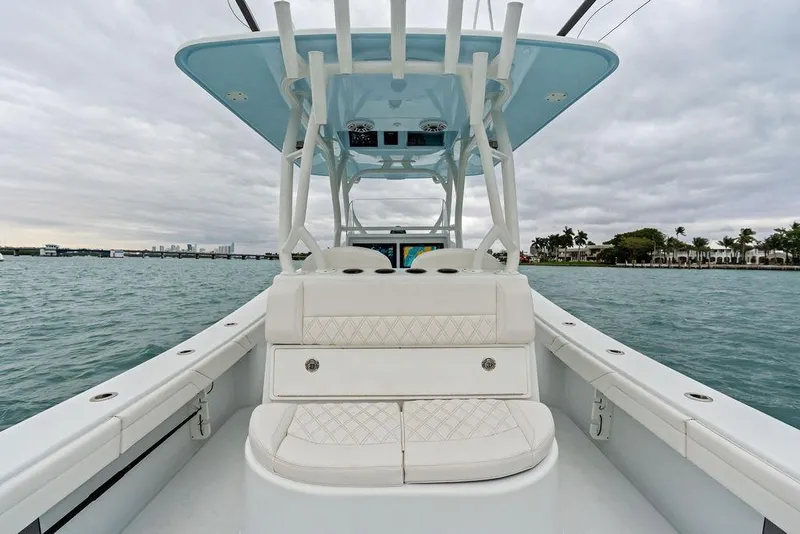 Slide: The Image of 2021 Yellowfin 36 Offshore boat on water, featuring sleek design and spacious seating. - 32