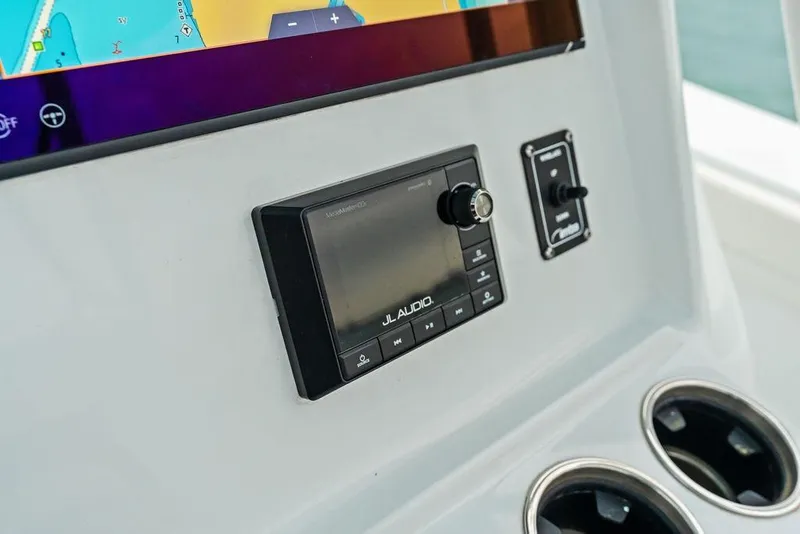 Slide: The Image of Control panel of 2021 Yellowfin 36 Offshore boat with JL Audio system. - 37
