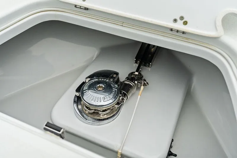Slide: The Image of Anchor locker of 2021 Yellowfin 36 Offshore boat, featuring a polished winch system. - 38