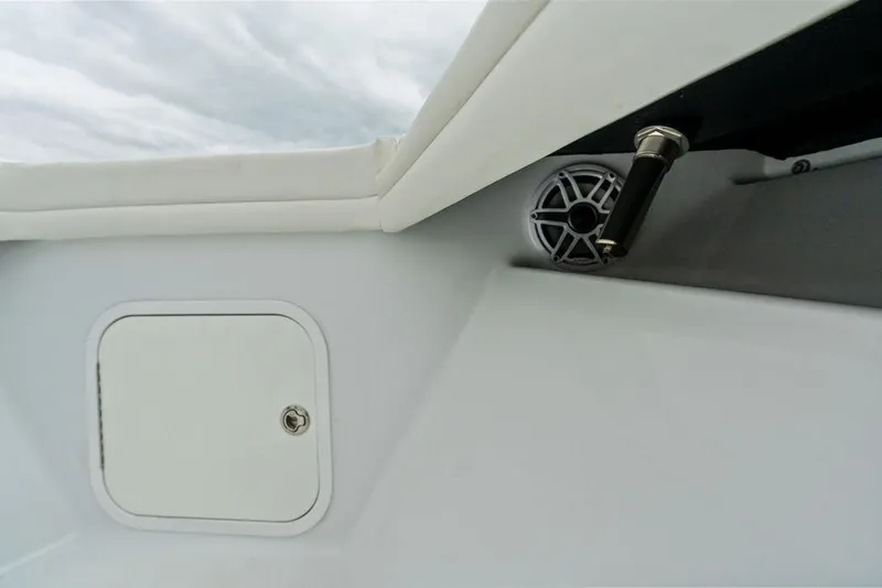 Slide: The Image of 2021 Yellowfin 36 Offshore boat interior with speaker and storage compartment. - 39