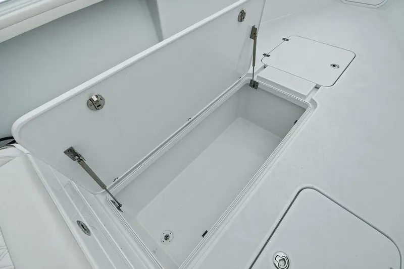 Slide: The Image of 2021 Yellowfin 36 Offshore boat storage compartment, open lid, spacious interior. - 40