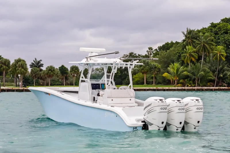 Slide: The Image of 2021 Yellowfin 36 Offshore boat with triple Mercury engines on tropical water. - 5