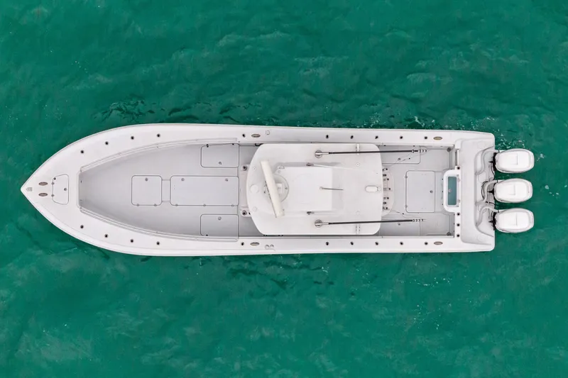 Slide: The Image of Top view of 2021 Yellowfin 36 Offshore boat on turquoise water. - 8