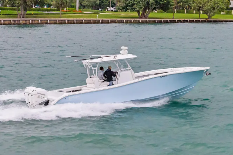 Slide: The Image of 2021 Yellowfin 36 Offshore boat cruising on water, side view. - 9