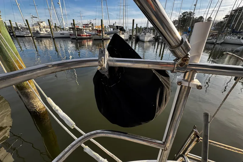 Slide: The Image of Sailboat docked at marina, featuring stainless steel railings, Bristol 29.9, 1977 model. - 13