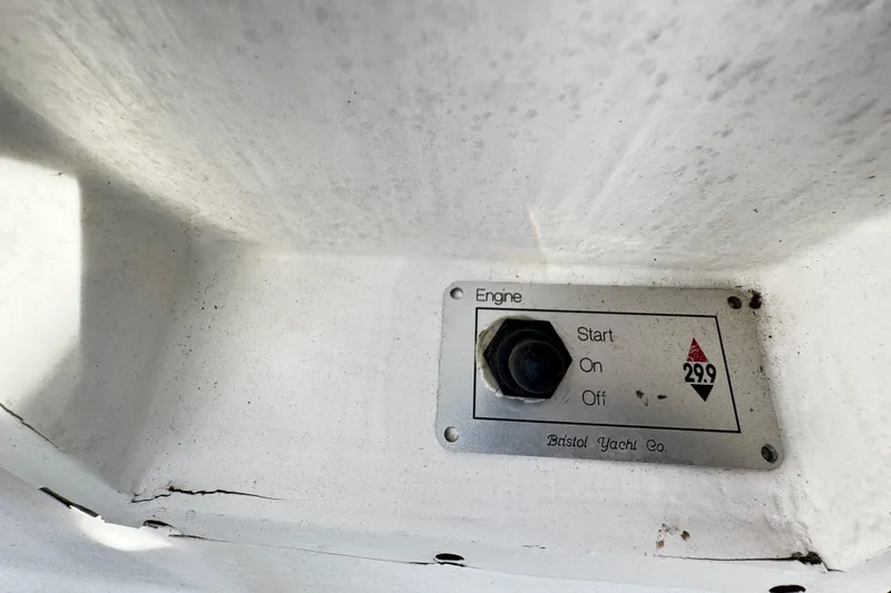 Slide: The Image of 1977 Bristol 29.9 yacht engine control panel with start, on, off options. - 17