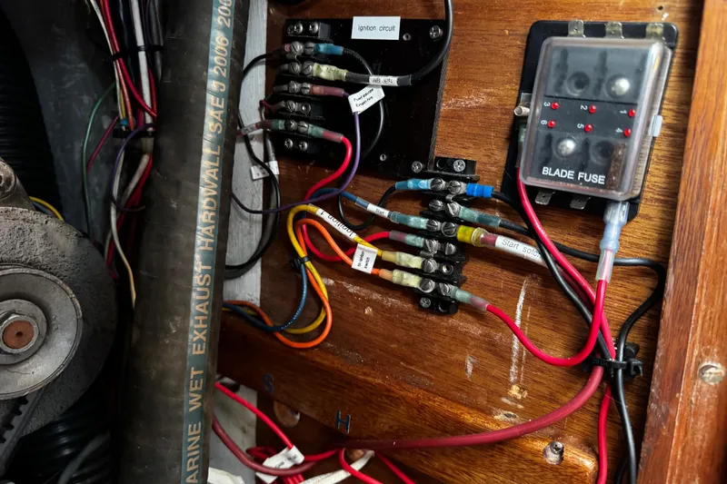 Slide: The Image of Electrical wiring and fuse box inside a 1977 Bristol 29.9 boat. - 25