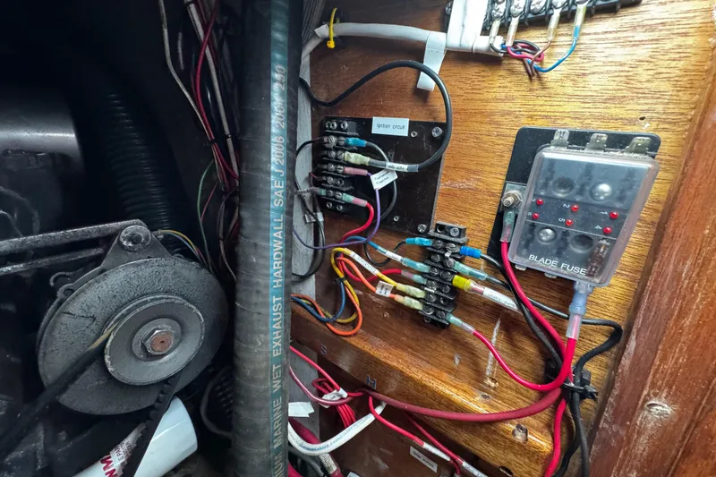 Slide: The Image of Electrical wiring and fuse panel in a 1977 Bristol 29.9 boat engine compartment. - 29