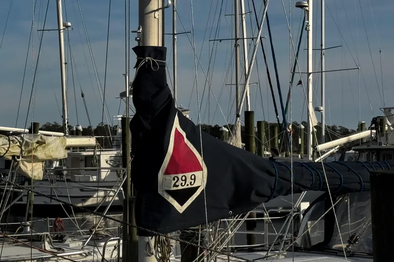 Slide: The Image of 1977 Bristol 29.9 sailboat mast and rigging at a marina. - 7