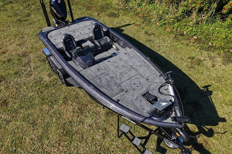 Slide: The Image of 2026 Falcon F20 PREDATOR fishing boat on grass, showcasing spacious deck and seating. - 2