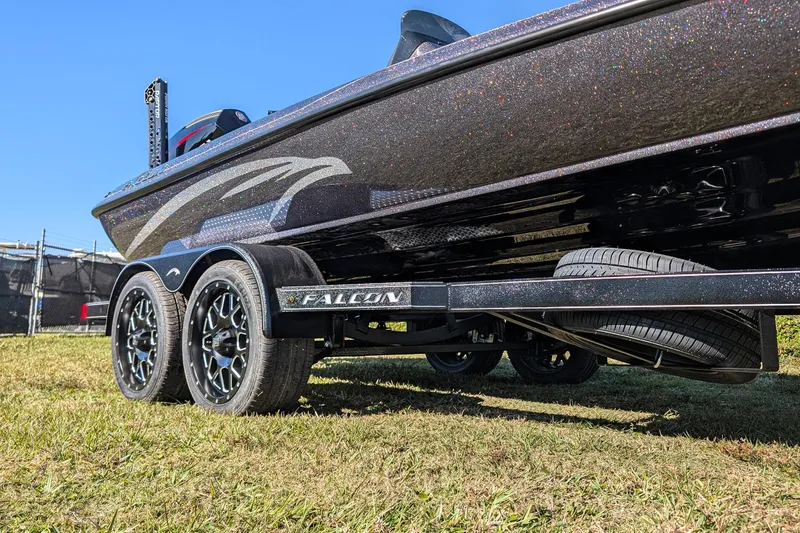 Slide: The Image of 2026 Falcon F20 PREDATOR boat on trailer, showcasing sleek design and dual axle wheels. - 7