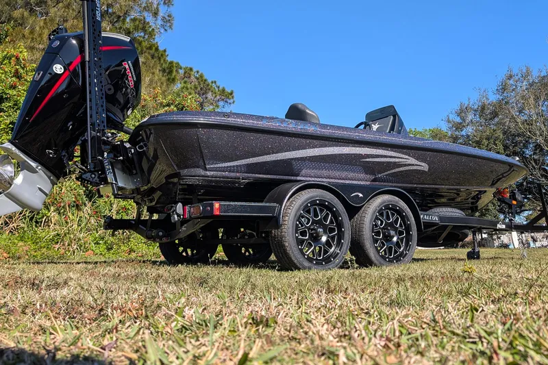 Slide: The Image of 2026 Falcon F20 PREDATOR boat on trailer, side view, outdoors, sunny day. - 9