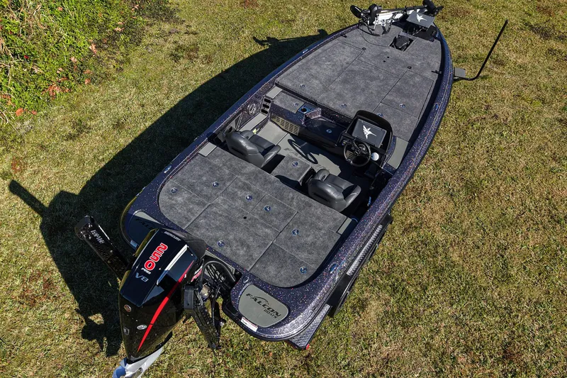 Slide: The Image of 2026 Falcon F20 PREDATOR boat on grass, showcasing spacious deck and modern design. - 1