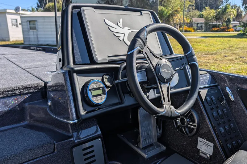 Slide: The Image of Steering console of 2026 Falcon F20 PREDATOR boat with modern controls and sleek design. - 19