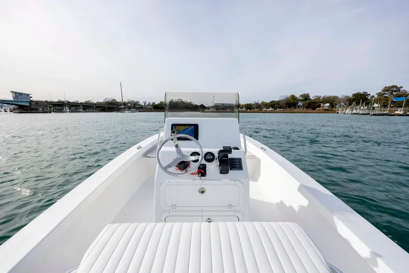 Slide: The Image of 2025 Intruder 23 boat on water, featuring sleek design and modern controls. - 24